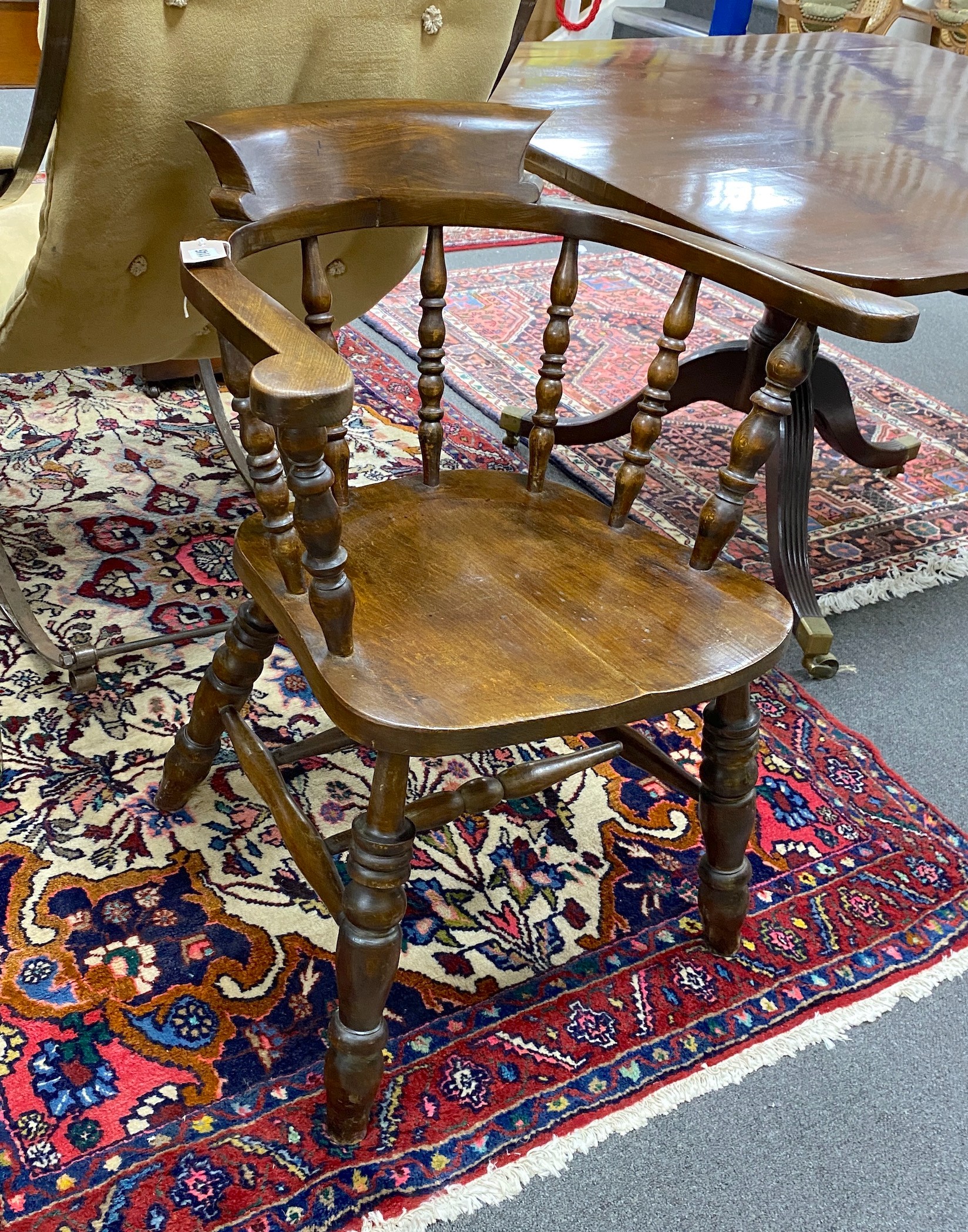A Victorian elm and beech smoker's bow elbow chair, width 63cm depth 47cm height 82cm
